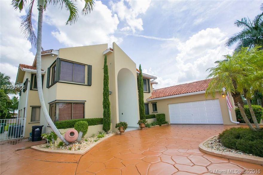Splendid Custom built 5bed/4.5bath pool home is the ultimate entertainment home.  This fine home offers 2bedrms on 1st fl & 3 Master Suites + Bonus Rm on 2nd fl.  The updated dream kitchen area opens to a large family rm w/ Custom Bar area ready for entertainment. Extend the party out to the large terrace/pool (refinished in 2015) area w/ Tiki Hut & built in BBQ/Grill station. Host special occasions w/ family & friends. 2 new a/c's. Search address on Youtube for video tour of home.  Come Home & Live Well!