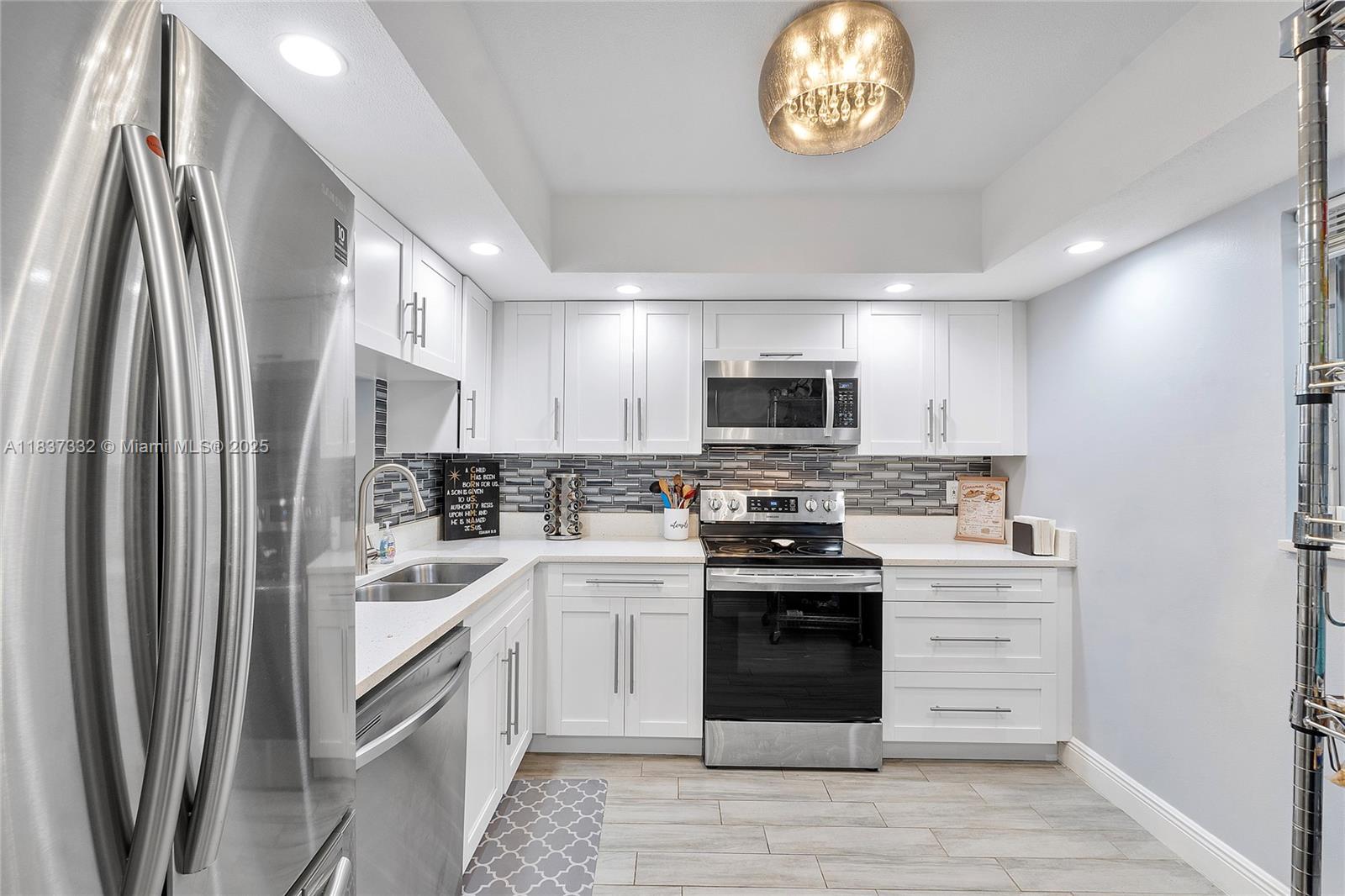 MOTIVATED SELLER! Move-in Ready Beauty in Coral Springs. Welcome home to this beautifully renovated 1st-floor 2-bedroom, 2-bath condo nestled in the vibrant heart of Coral Springs! Step inside and fall in love with the brand-new A/C unit, sleek quartz countertops, stylish backsplash, and modern LED faucet—all part of a high-end kitchen upgrade with stainless steel appliances. Enjoy the luxury of two fully remodeled bathrooms, fresh tile flooring, elegant crown molding, updated fixtures, and crisp new baseboards throughout. Unwind on your screened-in patio with tranquil water views, perfect for morning coffee or evening relaxation. This condo is the perfect blend of style, comfort, and convenience. Don’t miss out on this gem!