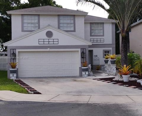 Photo of 110 E Riverbend Dr, Sunrise, FL 33326 (MLS # A11960410)