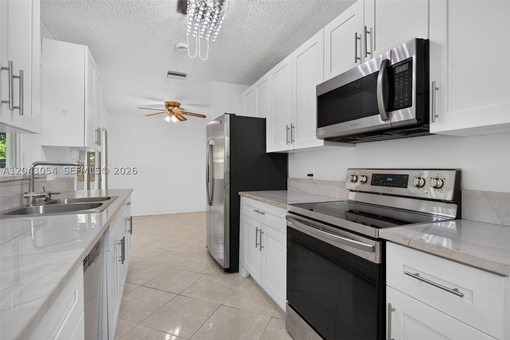 Photo of 2640 NW 67th Ter, Margate, FL 33063 (MLS # A12043054)