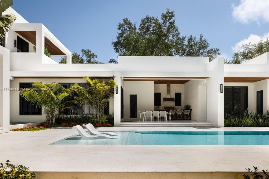 This brand new luxurious two-story corner residence features 7 bedrooms, 8 full bathrooms, and 2 powder rooms within a total of 11,557 Sq Ft, with 9,357 Sq Ft of living space, on a nearly-acre lot. It includes a designated office, media room, and exercise room. Elegant touches throughout the home include an artisan floating staircase, handcrafted and hand-pressed terrazzo slabs, and a double-sized master closet, adding a sophisticated flair to the design. The custom kitchen features custom white oak cabinets and high-end SubZero and Wolf appliances. With dual laundry rooms on both levels, service living quarters, and a separate guest house, privacy and comfort are assured. The outdoor space boasts an oversized heated saltwater pool with a spa and a summer kitchen, perfect for entertaining.