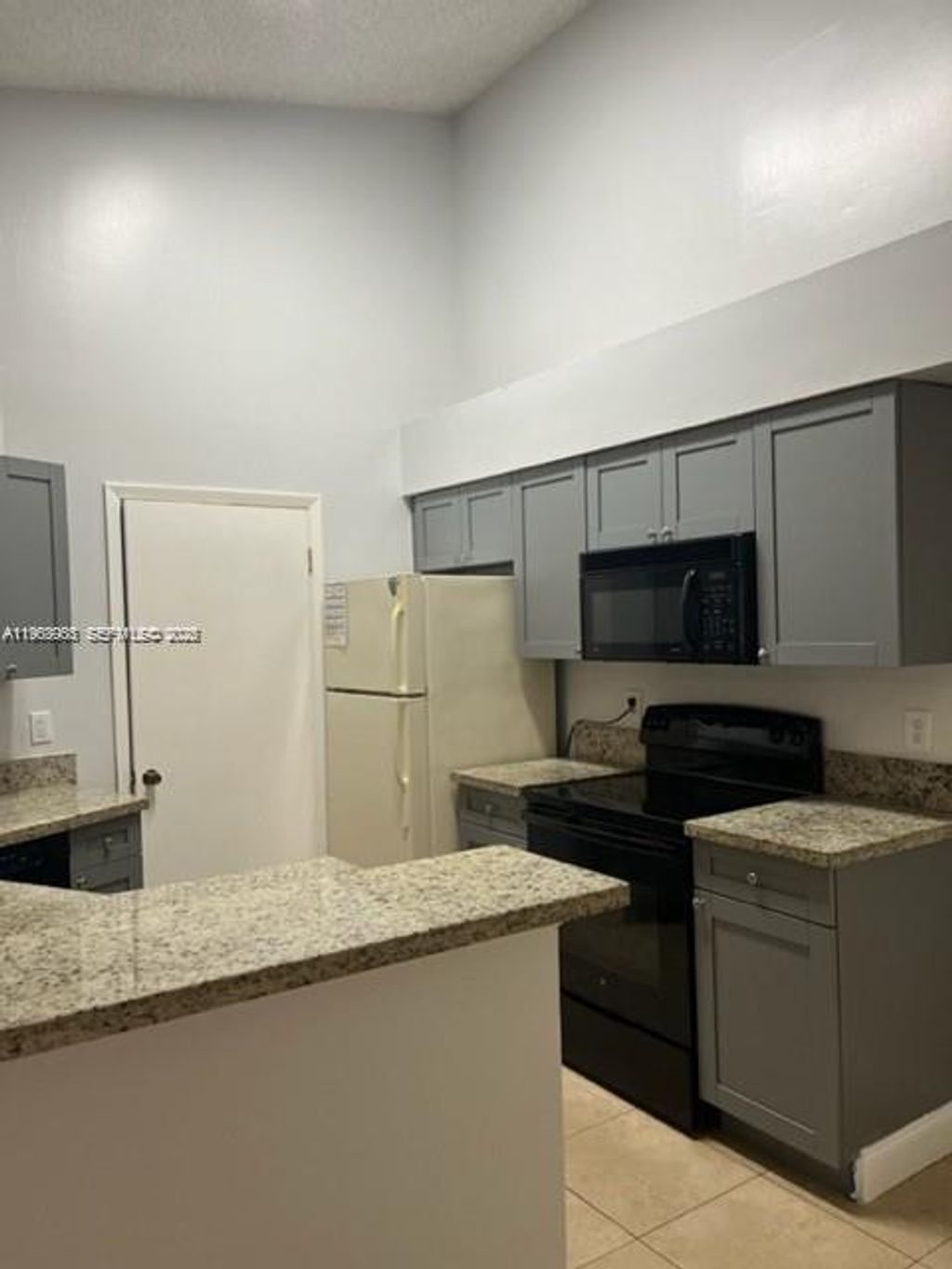 Photo of 9999 Summerbreeze Dr #1009, Sunrise, FL 33322 (MLS # A11963903)