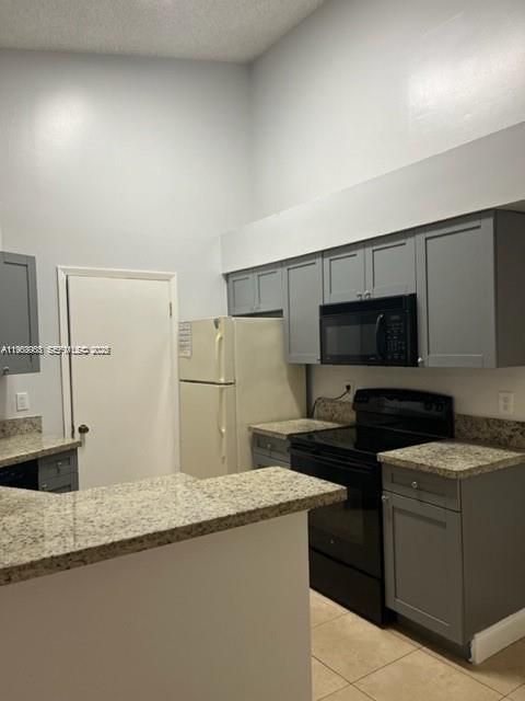 Photo of 9999 Summerbreeze Dr #1009, Sunrise, FL 33322 (MLS # A11963903)