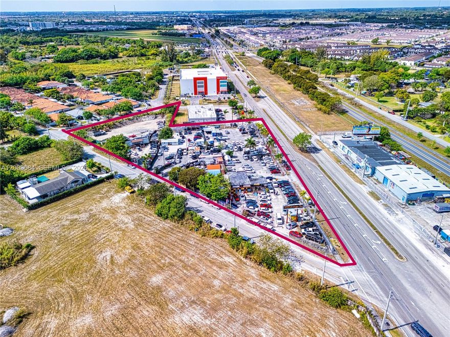 GROUND LEASE OPPORTUNITY-ALSO FOR SALE:  MLS: A11787665
Incredible covered land play or redevelopment opportunity on So Dixie Hwy, between Cutler Bay and Homestead, on SW 124 Avenue. This 2.5+ acre BU-3 zoned site is currently leased to small car dealers.BU-3 zoning, while excluding office use, does allow Wholesale Facilities, Spot commercial, Strip commercial, and neighborhood shopping centers. This liberal commercial zoning allows for the possibility of applying the Live Local Act, which would facilitate residential use as part of the redevelopment. The Florida Live Local Act aims to address the state's affordable housing crisis by providing various incentives and opportunities for developers to create workforce housing. It offers funding, land-use flexibility, and tax benefits to encourage the construction of affordable rental housing units.