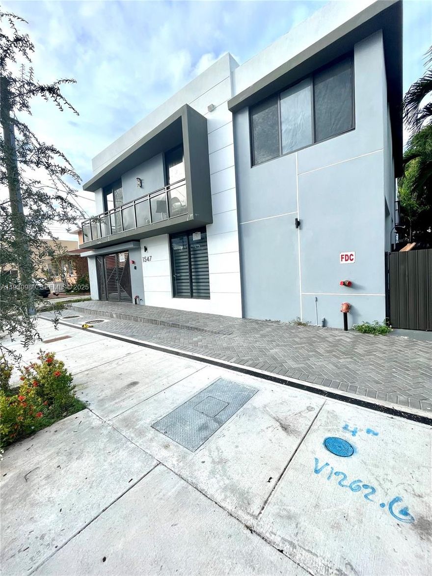 Grate opportunity in a NO flooding zone, a stunning 2 beds 1 bath split bedroom, newly constructed 2025 apartment building located in Little Havana steps from the Marlin Stadium near Downtown Miami and Brickell. Rent includes water, sewer and trash removal. Washer and dryer inside the unit for convenience. Street Parking.  This modern two-bedroom, one-bathroom unit located on a first floor for easy access offers high impact windows and doors a perfect blend of comfort and style. The unit features high-quality, sleek modern finishes, ceramic tile floors, and abundant natural sunlight throughout. The kitchen is fully equipped with contemporary cabinetry and all new appliances. This ideal location offers quick access to major highways and the beach. Only two months' rent for move-in. Please contact us to schedule a viewing or if you have any questions regarding the application process. Pet allows with a $300 not refundable fee .