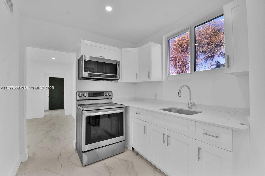 This fully remodeled 3 bedrooms unit offers a luxurious living experience in a prime location minutes away from Wynwood and Midtown. The unit has been thoughtfully redesigned with modern finishes and high-end amenities throughout. The open concept living area is perfect for both relaxing and entertaining, with plenty of natural light and space to move around. The gourmet kitchen features top-of-the-line appliances, sleek cabinetry, and ample counter space for meal preparation. Each of the three bedrooms is spacious and inviting, providing a peaceful retreat at the end of the day. Additionally, the unit includes updated bathrooms, hardwood floors, and in-unit laundry for added convenience. Don't miss out on the opportunity to rent this stunning and meticulously remodeled 3 bedroom unit.