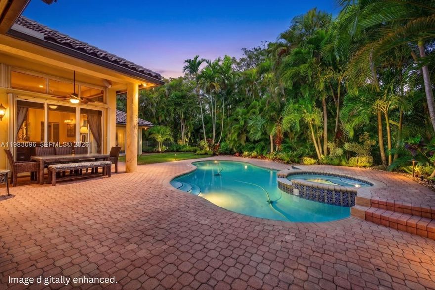 STUNNING CUSTOM HOME in the Grand Palms GOLF COMMUNITY. SINGLE STORY living with NO STEPS, designed for comfort & entertaining w/ a stellar triple split floor plan on an OVERSIZED PRIVATE LOT with no neighbor behind & a CUL-DE-SAC street. The open floor plan flows seamlessly to a tropically landscaped & oversized backyard oasis w/ LANDSCAPE LIGHTING, SALT CHLORINATED HEATED POOL & SPA w/ UPDATED EQUIPMENT, grassy area, EXPANDED OVERHANGS & extended paver patio & driveway & integrated outdoor sound system, perfect for gatherings w/ EASTERN EXPOSURE for breezes and soft lighting in backyard. Volume ceilings, custom closets, BUILT-IN OFFICE (1 bedroom converted) w/ wine cooler, WOOD BURNING FIREPLACE & luxury wrought iron lighting. Recent updates and high-end systems include a '17 ROOF, '26 WATER HEATER, '23 TRANE & '16 Rheem A/Cs. Updated kitchen WOOD CABINETS, Dacor refrigerator & Bosch D/W, Warming Drawer, commercial style hood & all Bathrooms updated w/ Wood cabinets & Granite Counters. EV Car Ready + OVERSIZED GARAGE for 2 cars & a GOLF CART or gym. Indoor & outdoor speakers (Bose, Yamaha & Sonos), Ring doorbell, IMPACT FRONT DOORS, accordion hurricane shutters. Plus, ELECTRIC SAID TO BE ON HOSPITAL GRID! One of Pembroke Pines’ most desirable communities w/ LOW HOA which INCLUDES: 24/7 SECURITY, on site management, CABLE, HIGH SPEED FIBER OPTIC INTERNET, ADT ALARM, SPRINKLER REPAIR & community maintenance. A RATED ELEMENTARY & MIDDLE SCHOOL.