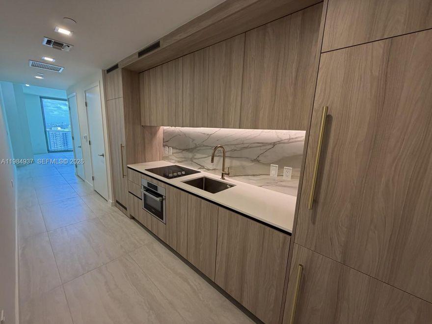 Step into refined urban living with this exceptional brand-new studio at the exclusive Viceroy Residences, ideally located in the vibrant center of Brickell. Designed with both style and practicality in mind, the residence offers a private balcony along with the convenience of an in-unit washer and dryer. Enjoy a lifestyle of comfort and sophistication with access to an impressive selection of resort-inspired amenities, including a fully equipped fitness center, sauna, resort-style pool, jacuzzi, and beautifully designed BBQ areas ideal for hosting guests. Residents also have access to a variety of upscale social and entertainment spaces, such as a billiards room, private screening theater, wine tasting lounge, elegant coffee area, chic bar room, and advanced simulation rooms—including an immersive Formula 1 racing experience. Perfectly situated just steps away from Brickell’s premier dining, shopping, and entertainment destinations, this residence offers the ultimate blend of luxury and convenience.