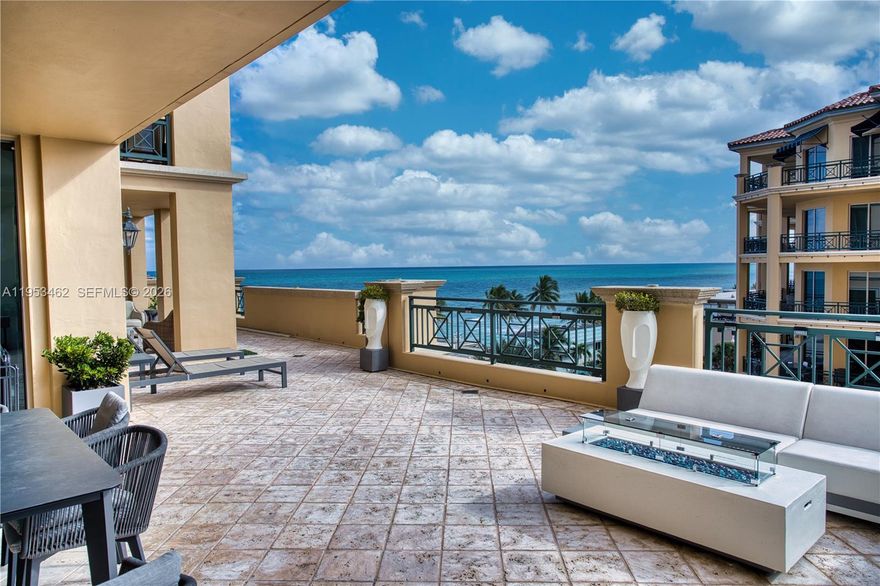 Wake up to ocean breezes and elevated coastal luxury in this spectacular 2,700 SF residence at Villas of Positano along Hollywood Beach. With nearly 1,000 SF of private terrace showcasing sweeping ocean and Intracoastal views, this 3-bedroom, 3.5-bath home delivers a rare indoor-outdoor lifestyle just steps from the sand.
A private elevator foyer opens to a keyless refined interior featuring marble flooring throughout, LED lighting, and 9-foot hurricane-impact sliding glass doors that flood the home with natural light. The expansive terrace is designed with two distinct zones and enhanced by smart motorized curtains, smart patio lighting, lush planters, a fireplace, hurricane shutter screens, and BBQ grill for both indoor and outdoor entertaining.
The gourmet kitchen offers high-end appliances and gas cooking, while the residence is upgraded with smart toilets, new shower fixtures, and a custom Italian marble TV cabinet.  the room room is ideal for media/den which has been converted into a third bedroom with en-suite bath and closet, ideal for guests or a home office, three large walking closets.  Two private parking spaces, garage storage, closed-circuit video surveillance, and high-end furniture available for a turnkey luxury experience. This beautiful building has its own gym access, if you are looking to sweat out there is a sauna in the gym facility. This unique home offers free valet to guests at any time. Access to the beach is one minute away in front your home.