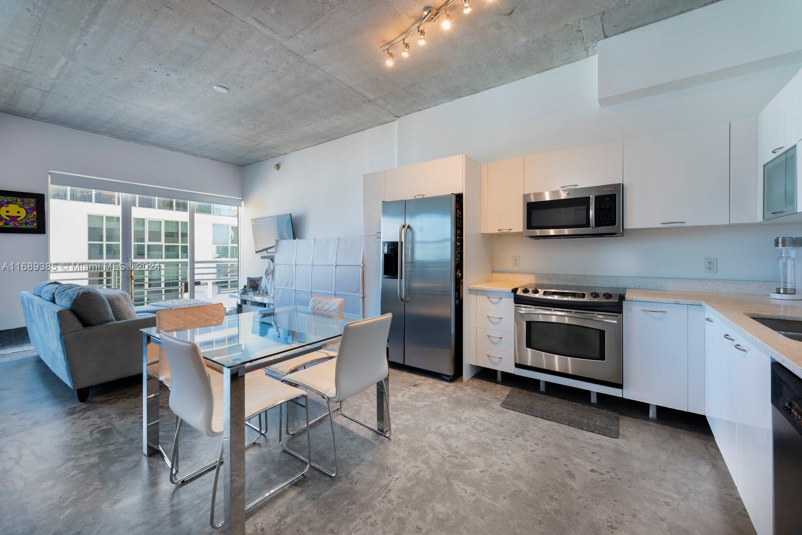 Welcome to our modern loft-style apartment in the heart of Miami. Unit features 10-foot ceiling, impact-resistant windows, and sliding glass doors that offer stunning skyline views. The finished concrete and tile flooring give a sleek and contemporary feel, while the fully-equipped kitchen with granite countertops and stainless-steel appliances make cooking a breeze. Enjoy the convenience of a private balcony and in-unit washer/dryer. Stay active in our state-of-the-art gym with a 180-degree view, or relax by the pool on sunny days. Experience luxury living at its finest in our Miami apartment. Contact us today to schedule a tour!