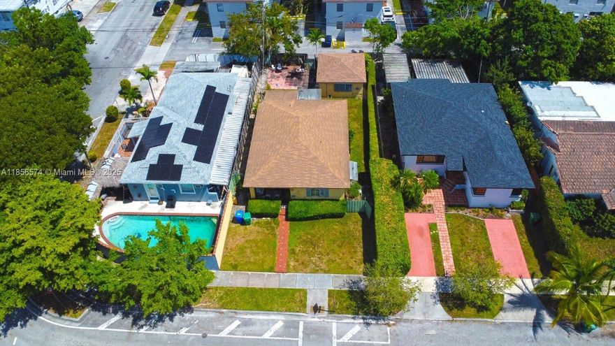 Outstanding opportunity in Silver Bluff! This property features a 3-bedroom, 3-bathroom main home plus a 1-bedroom, 1-bathroom detached dwelling unit at the rear of the lot—perfect for guests, extended family, or rental income. The main house boasts classic terrazzo floors and a 4-year-old roof, while the detached unit has a brand-new roof. Dual access from both the east and west sides of the property offers convenient space to store a boat, trailer, or additional vehicles. With great bones and tremendous renovation potential, this home is a rare find in a highly desirable neighborhood.