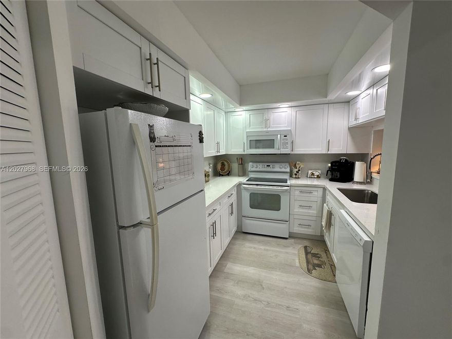 Gorgeous condo completely remodeled top to bottom. Features: updated kitchen, bathrooms, and floors; an in-unit washer and dryer; recessed lighting throughout; 1,045 square feet. Sit on your patio overlooking the golf course and watch the sun set. Community offers Clubhouse, Movie Theater, Billiard Rooms, Clinic, Convenience Store, Shuffleboard, Tennis, Gym, Multiple Pools, a host of arts and craft classes, clubs, and so much more in this amazing 55+ community. Transportation to surrounding medical and retail locations. No Pets