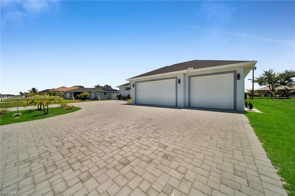 Welcome to your dream home! Nestle in a prime location!!This stunning new construction residence seamlessly blends luxury, comfort, and functionality. With 4 spacious bedrooms and 3 full bathrooms, this home offers the perfect layout for families or those who love to entertain. Sleek tile flooring throughout, impact windows and doors, outdoor kitchen, central water and sewer, screen pool with spacious patio area and a 3-car garage plus a circular driveway for ample parking and curb appeal.