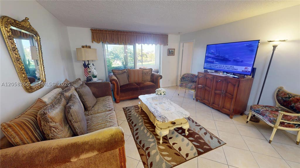 Photo of 9320 Sunrise Lakes Blvd #303, Sunrise, FL 33322 (MLS # A12058266)