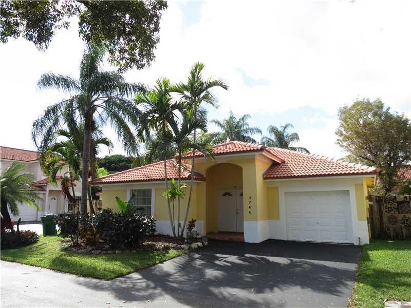 Enjoy Doral living in this updated 3/2! Featuring travertine marble floors throughout, natural stone bathrooms, espresso kitchen cabinetry, vaulted ceiling, and a new barrel tile roof. Screened patio and built-in grill area perfect for summertime cookouts . Gated private community next to trump GC and across from Morgan Levy Park.