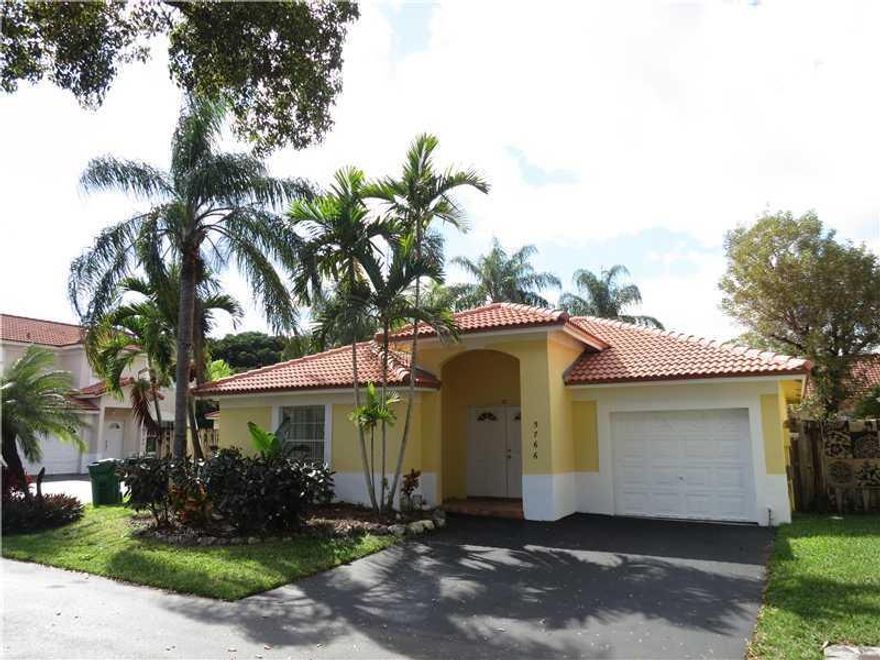 Enjoy Doral living in this updated 3/2! Featuring travertine marble floors throughout, natural stone bathrooms, espresso kitchen cabinetry, vaulted ceiling, and a new barrel tile roof. Screened patio and built-in grill area perfect for summertime cookouts . Gated private community next to trump GC and across from Morgan Levy Park.