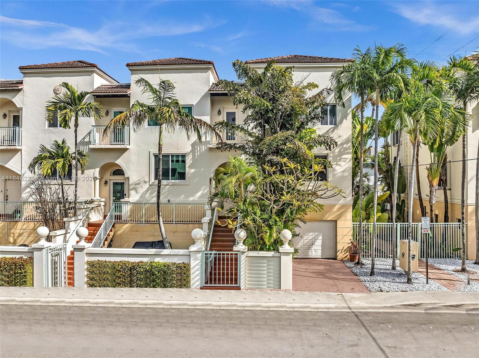 Situated in the heart of Bay Harbor Islands, this spacious townhome is just a short walk from the A-rated Ruth K. Broad Elementary School, Kane Concourse, Bal Harbour Shops, and houses of worship. With approximately 3,000 square feet, the home features a converted garage offering an office, storage, and family room. The bright living/dining areas include custom built-ins, and the updated kitchen boasts stainless steel appliances. This 5-bedroom, 3.5-bathroom residence offers shared pool access, a private driveway, and permit street parking—ideal for family living in a prime location.