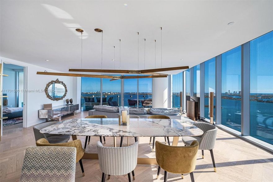 Experience the epitome of luxury living in one of Miami's most coveted waterfront addresses. This never lived in rare custom combo corner residence offers 2 bedrooms + den & 2.5 baths, with a private foyer. Residence features panoramic views of the serene bay, ocean & vibrant city skyline, from sunrise to sunset. Every detail has been thoughtfully curated, from the herringbone parquet floors & bespoke custom closets to the refined Henge light fixtures. The residence is adorned with iconic design houses such as Henge, Baxter & Missoni Home (furniture to be negotiated in addition to). Ideally situated with a perfect walkability score, mins from Miami's best dining and shopping. Residents enjoy access to five-star amenities, including three pools, luxurious spa/sauna, tennis court & more