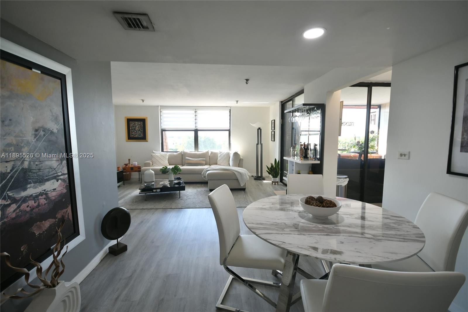 Completely remodeled condo in prime location. Enjoy low association fees, NO ASSESSMENTS, & a variety of amenities. This beautifully maintained & tastefully decorated home features a sleek modern kitchen with shiny white cabinets, stainless steel appliances, & updated flooring throughout. Both bathrooms have been stylish remodeled & the condo offers abundant natural light plus a relaxing screened balcony- perfect for enjoying time with family & friends. The well-kept community features a secure coded entrance, a gym, pool & sauna, & wonderful lake views around the pool area. Association fees include water, cable, and internet. Conveniently located near Aventura Mall, beaches, many restaurants & shopping malls, & major highways. A must see!