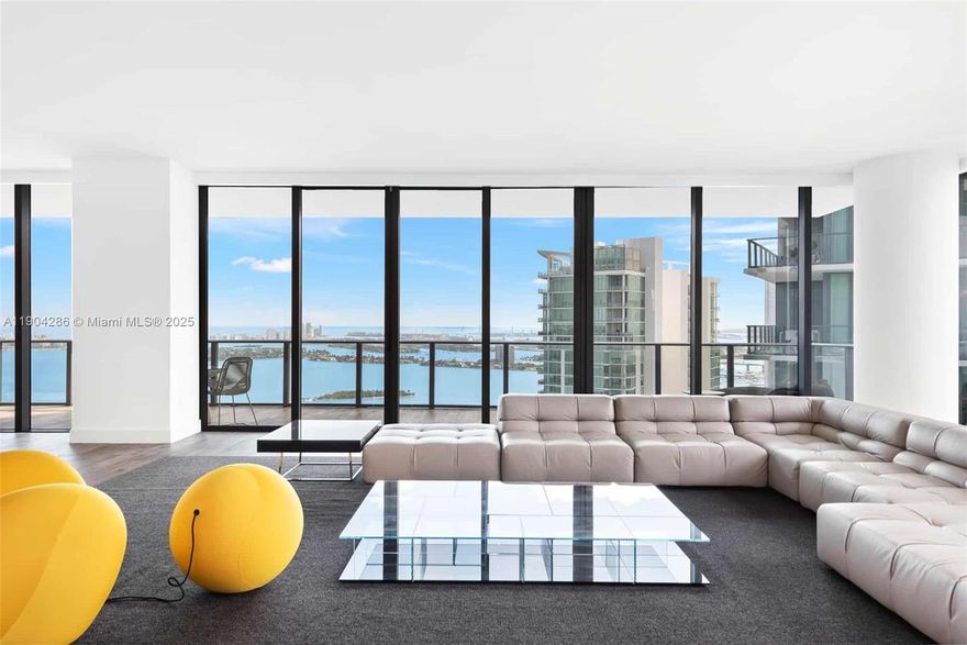 Nestled in Miami's Luxury Edgewater District, this 4 bed, 5.5 bath, 5,042 SF residence is two penthouses combined into one and recently upgraded, available unfurnished, fully or partially furnished with B&B Italia pieces. Enjoy sweeping 52nd floor views of Biscayne Bay, Miami Beach, and the city. The enclosed kitchen with a butler's private entrance and two private elevators enhances discretion. Two primary bedrooms and a guest wing on the opposite side provide privacy when hosting. Two spacious balconies, including one spanning the length of the home, offer stunning viewpoints and Miami sunsets. A true house in the sky, PH 5201 embodies South Florida luxury. Every amenity you could ask for, including golf simulator, cigar lounge, spa, and tennis. Move in ready. Available January 15th 2026