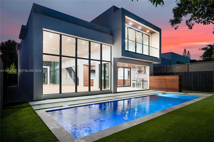 Located just a few blocks from the Miami Design District, this new construction modern residence with 5 bedrooms, 5 full bathrooms and 3,690 total SqFt. The home's large pivot door leads into a bright, open interior featuring soaring 13 feet with expansive windows overlooking the pool. High-end finishes include white oak flooring, Hansgrohe fixtures, impact windows and doors, sleek floor to ceiling cabinetry, and premium Sub-Zero/Wolf appliances. Designed for indoor-outdoor living with heated pool, covered terrace, and fully equipped outdoor kitchen with refrigerator. Additional highlights include a 1.5 car garage with storage space, elevated lot over 14 feet above sea level, and a prime location near Wynwood, Midtown, and Miami's top beaches (not in a flood zone). Home next door(215) also available, presenting a rare opportunity for side by side ownership.
