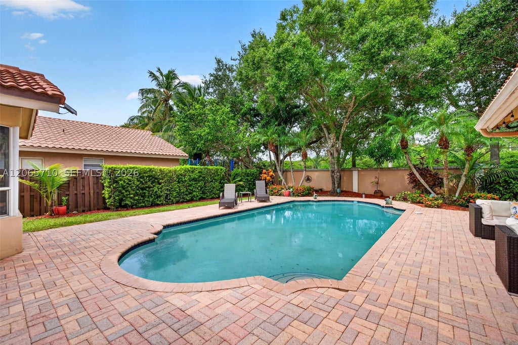 Photo of 581 NW 110th Ave, Plantation, FL 33324 (MLS # A12065710)