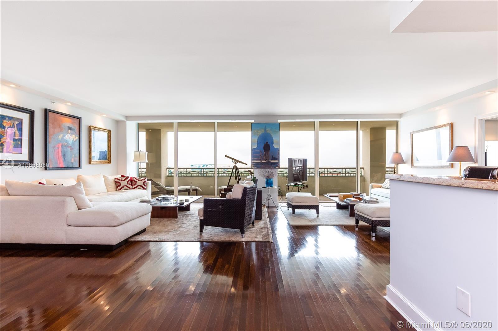 SELLER FINANCING . Enjoy the lifestyle of the Residences Ritz-Carlton, Coconut Grove. Step into an unobstructed skyline
view of Coconut Grove and downtown Coral Gables from this high-floor residence. Expansive, open
living/dining room with split bedroom floorplan & huge master bedroom and bath. Also includes a
bonus room - den or 3rd bedroom with jack & jill bath. Gorgeous Brazilian cherry wood floors
throughout. Huge terrace great for outdoor entertaining.