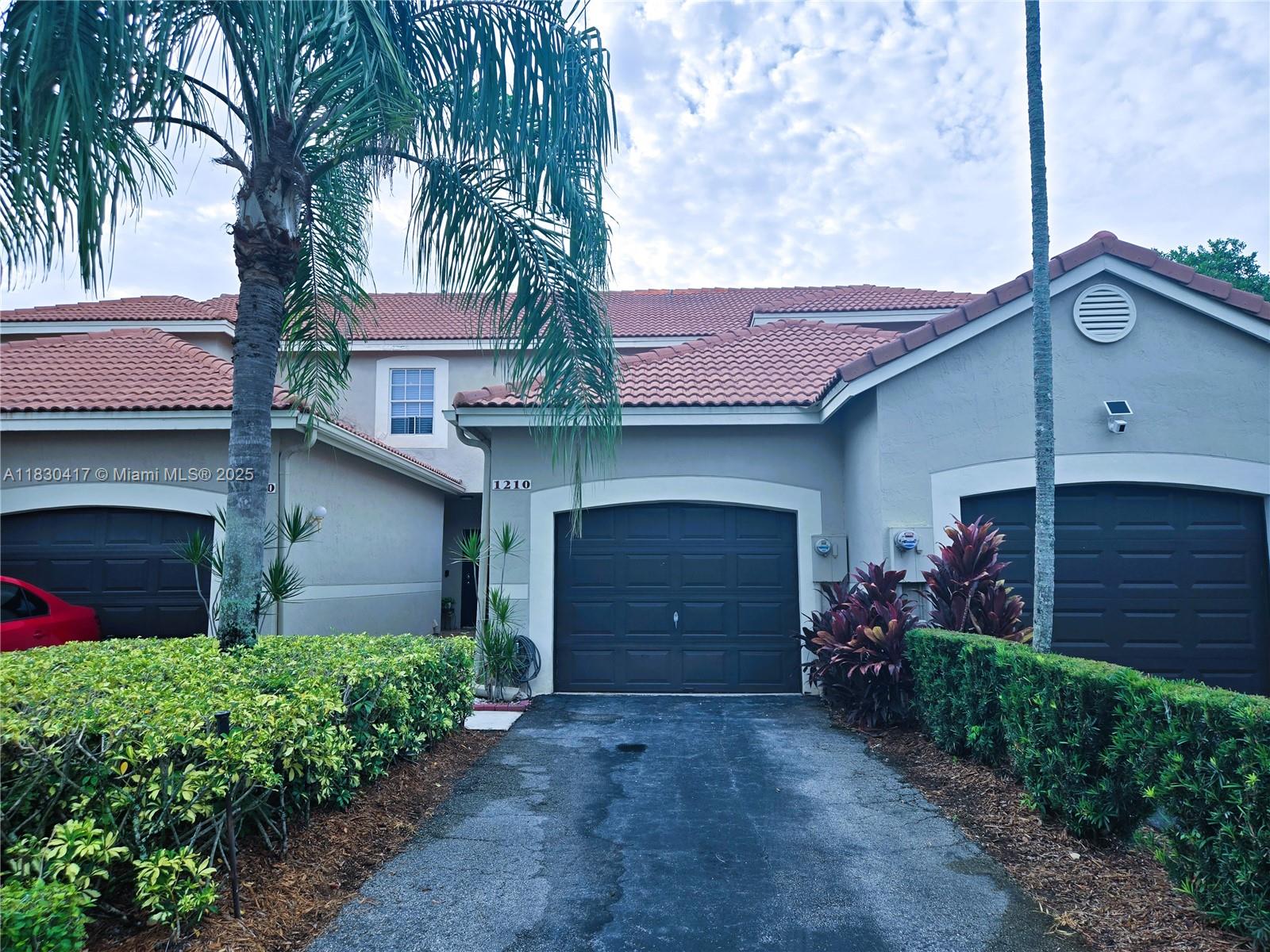 Beautiful and well-maintained townhouse in the great City of Weston with some of the best schools in Broward County. All tiled floors on the first floor, laminates on the second floor. Two master bedrooms with own bathrooms on the second floor and a guest half bathroom on the first floor. Breakfast area, full size washer and dryer. Screened patio. One car garage, driveway and guest parking available. This is a gated community. There is a Club House with Swimming Pool, Children's Playground, Basketball Courts in the community. This townhouse is close to shopping, restaurants, hospitals and easy access to highways for easy commute in any direction.