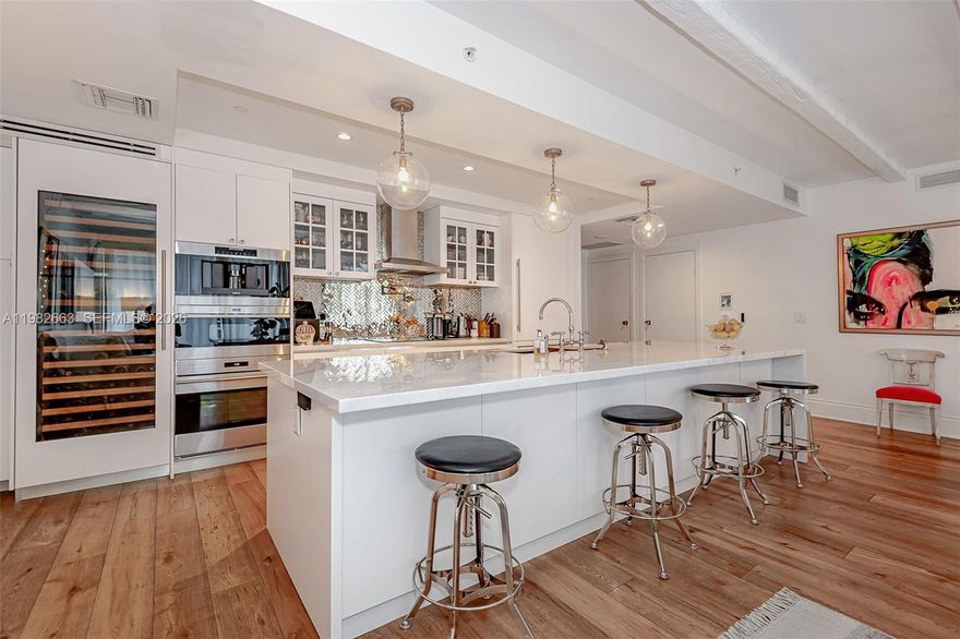 Opulent SLSLux Brickell - High Floor Premium Residence offering over 1,700+ interior space completely redesigned and upgraded with the finest finishes - a luxurious South Hampton feel in every aspect and design point.  This 45th floor home is a combined 07/08 residence offering a split plan en-suite design plus an additional family room/den/office/3rd bedroom with full bath and yet another 4th full bath for guests.  The oversized balcony spans the entire residence with stunning north, east and western views.  Wide plank white oak flooring throughout, complimented by architecturally inspired French Country exposed beam ceilings.  An expanded, extensively redesigned kitchen features impeccable Calcutta snow solid slab counters and waterfall island, Wolf/Bosch/Sub Zero appliances, a Kallista fixture plus an absolutely stunning backsplash of handmade mirrored tile plus a truly convenient pot filler right at the cooktop.  Additional culinary design points include a large custom wine closet and in-cabinet cappuccino maker - a true culinary dream.  Each en-suite with expansive closets, custom cabinetry and blackout shades.  Additional den/office/bedroom with full bath -plus- a fourth full bath for guests.  2 private self parking spaces.  Easy to show - Call/message Listing agent plus ShowingTime.