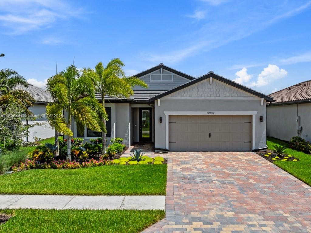 Nearly new Mystique model in Del Webb Naples with $114K+ in builder upgrades and a scenic lakefront lot. This 2-bed + den, 2-bath home features zero-corner sliding doors opening to an extended screened lanai—ideal for lake views and future pool. The kitchen has quartz counters, stainless appliances, backsplash, and custom cane pendant lights. Tile flooring throughout, plantation shutters, impact windows, and glass front door add style and security. The 2.5-car garage fits a golf cart, workshop, or storage. Golf cart may be sold separately. Furniture negotiable. Enjoy the Del Webb 55+ lifestyle: clubhouse, gym, pickleball, resort pool, activities, and optional golf membership and golf cart available.