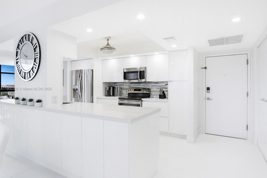 MODERN COASTAL LUXURY WITH OCEAN & INTERCOASTAL VIEWS! Fully renovated 2BD/2BA + DEN corner residence. Featuring a wrap-around balcony and direct beach access, this 1,360 SF home offers stunning ocean, intercoastal, and sunset views floor-to-ceiling hurricane-impact windows. The kitchen showcases quartz countertops, island, and custom cabinetry, opening to spacious living and dining areas. Porcelain floors, custom closets, and high-end finishes throughout create a serene coastal retreat. Resort-style amenities: 24-hour security, tennis courts, heated pool, fitness center, billiard room, and renovated lobby. The building has completed its 50-year certification, freshly painted, and has no special assessments. Lowest association on the ocean only 830. NO special assessments.