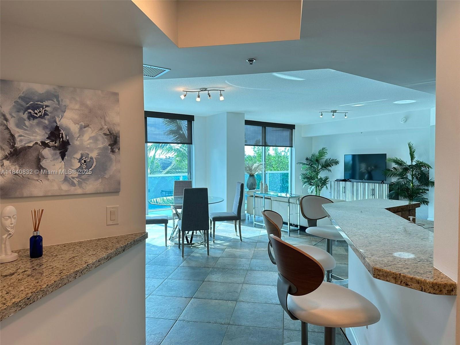Gorgeous and spacious 1,500 sq. ft. apartment features 2 bedrooms, 2 bathrooms, and a Den (which can be utilized as a third bedroom) in the highly desirable Tao Sawgrass. Unit has an open-concept layout with floor-to-ceiling windows, a modern kitchen equipped with granite countertops, stainless steel appliances, & a large private balcony. The den offers flexibility, as a third bedroom or an office. The master suite includes a walk-in closet & a spa-like bathroom with a separate tub and shower. Includes furniture, washer/dryer, and 2 parking spaces. Resort-style amenities, such as a fitness center, pool, sauna, tennis courts, playground, putting green, BBQ area, and 24-hour security. Conveniently located across the street from Sawgrass Mills, restaurants, and major highways.