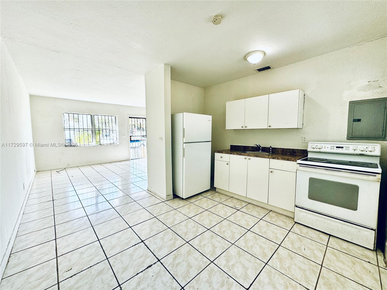 A unique opportunity awaits with this charming duplex! Located on a 7,436 sq ft lot, this property offers two independent units, each with 2 bedrooms and 1 bathroom. One unit is rented, providing immediate income, while the other is vacant and ready for a new tenant or owner. Both units feature central A/C installed in the past 5 years. The property also boasts a large yard with room to expand or create whatever you desire, depending on zoning regulations. Each unit has its own water meter and electric panel. Located on a corner, directly across from Shoppes of Liberty City, and minutes from I-95, this duplex offers both investment potential and the opportunity to make it your home. Don’t miss out on this vibrant neighborhood!