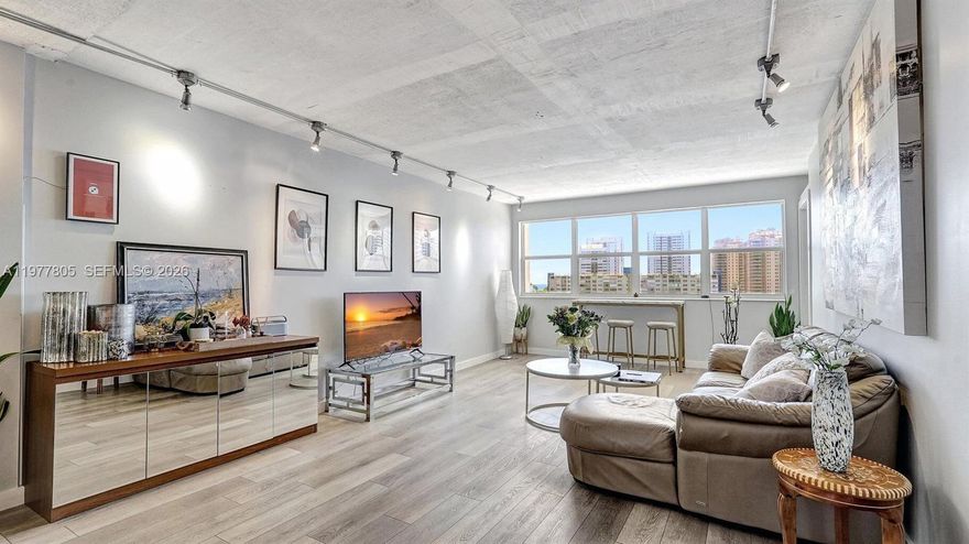 Discover boutique waterfront living in Golden Isles. This spacious 2-bedroom, 2-bath residence offers a rare blend of loft-style character and tranquil water views in an intimate waterfront community. Inside, the residence features high ceilings, exposed walls, and industrial lighting, creating a warm and distinctive atmosphere rarely found in traditional condo layouts. The sun-filled living area and both bedrooms overlook the water, bringing natural light and calming views throughout the home. Enjoy the best of South Florida living with a heated waterfront pool overlooking the Intracoastal, a poolside BBQ area perfect for outdoor dining and entertaining, and on-site dockage for boating enthusiasts. The building also offers gated entry and covered parking, providing privacy, convenience, and security within this boutique setting. Ideally located minutes from Hallandale Beach, Gulfstream Park, Aventura Mall, shopping, dining, and vibrant nightlife, this waterfront residence offers the perfect combination of character, lifestyle, and location. Seller will pay the current special assessment in full at closing.