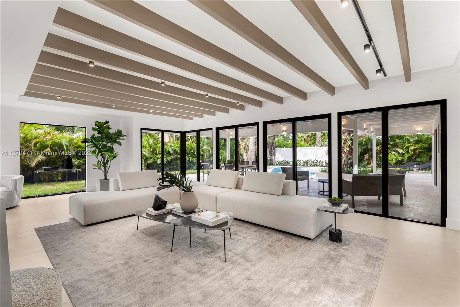Turnkey, immaculately renovated residence on oversized, gated 13,000-sq.ft. corner lot in prized Coconut Grove. Ample natural light and meticulous design by acclaimed Farache Bromberg Design Studio & Casa DDI, the 5-bed, 4.5-bath home features new open floorplan with wood and porcelain floors throughout. Custom Chef’s kitchen boasts Miele appliances and expansive island with waterfall edge, plus formal dining room, living room with refinished exposed wood beams, and sitting room. Enjoy double-height master suite, all brand-new baths and green roof area. A true entertaining oasis perfectly blending indoor/outdoor living with sizable covered terrace overlooking the diving pool and lushly manicured grounds with enchanting oak trees. Brand new metal roof, electrical, plumbing, A/C, irrigation.