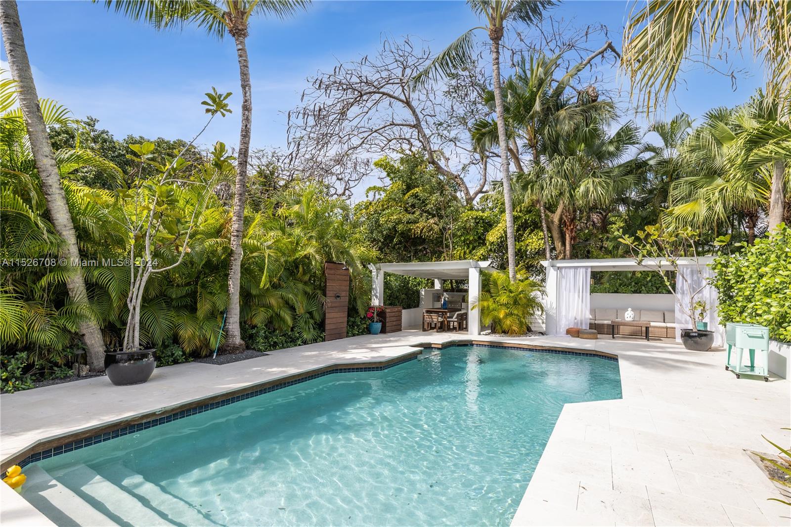 Welcome to this renovated Mediterranean style gem in historic Bayside district. Charm and modernity blend in this flawlessly designed open-concept living, dining, and kitchen, highlighted by an exquisite marble fireplace with tons of light, Step outside a private oasis featuring a teak deck, verdant garden, multiple relaxation zones, and an kitchen complete with a grill - perfect for gatherings or simply relaxing after a long day. An oversized master with an en-suite zen bathroom and walking closet, 2nd bed/bath and laundry area in second floor. Thoroughly updated with a new roof from 2017, impact-resistant windows, a new pool pump, heathers, recessed lighting and more. This non-flood zone residence combines luxury, safety, and comfort in one of Miami's most sought-after communities.