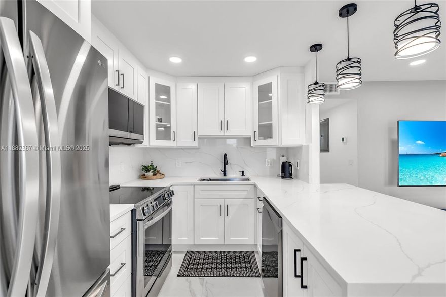This is the one you’ve been waiting for! Absolutely the finest 2/2 waterfront condo in Century Village. Fully renovated top to bottom, complete transformation, new baseboards, European flooring, stunning modern bathrooms, brand-new contemporary kitchen top-of-the-line appliances. Freshly updated AC, lighting, and fixtures make this home shine with quality and care. The attention to detail is unparalleled! Enjoy breathtaking water views from your own home, resort-style amenities at the 5-star, world-class clubhouse. Movie theater, fitness center, exercise rooms, art & ceramics studios, woodworking, tennis, pickleball, over 70 clubs to explore, never a dull moment. Conveniently located near shopping, fine dining, and offering free bus service. This one is truly a must-see! Don’t miss out!