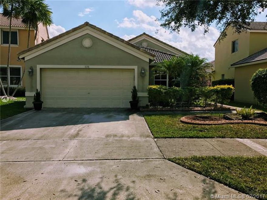One story home split floor plan located at The Falls which provides 24 hours security guard gate and the community offers pool and much more amenities. The house sits on a cul de sac perfect for the family. The entryway draws you into a voluminous layout made for entertaining. The flooring is tile through the property except for laminated flooring in the bedrooms. The laundry room is inside the house.The nice size backyard is completely fenced and the patio is screened which provides privacy.
