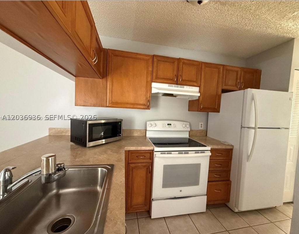 Photo of 937 Coral Club Dr #937, Coral Springs, FL 33071 (MLS # A12036936)