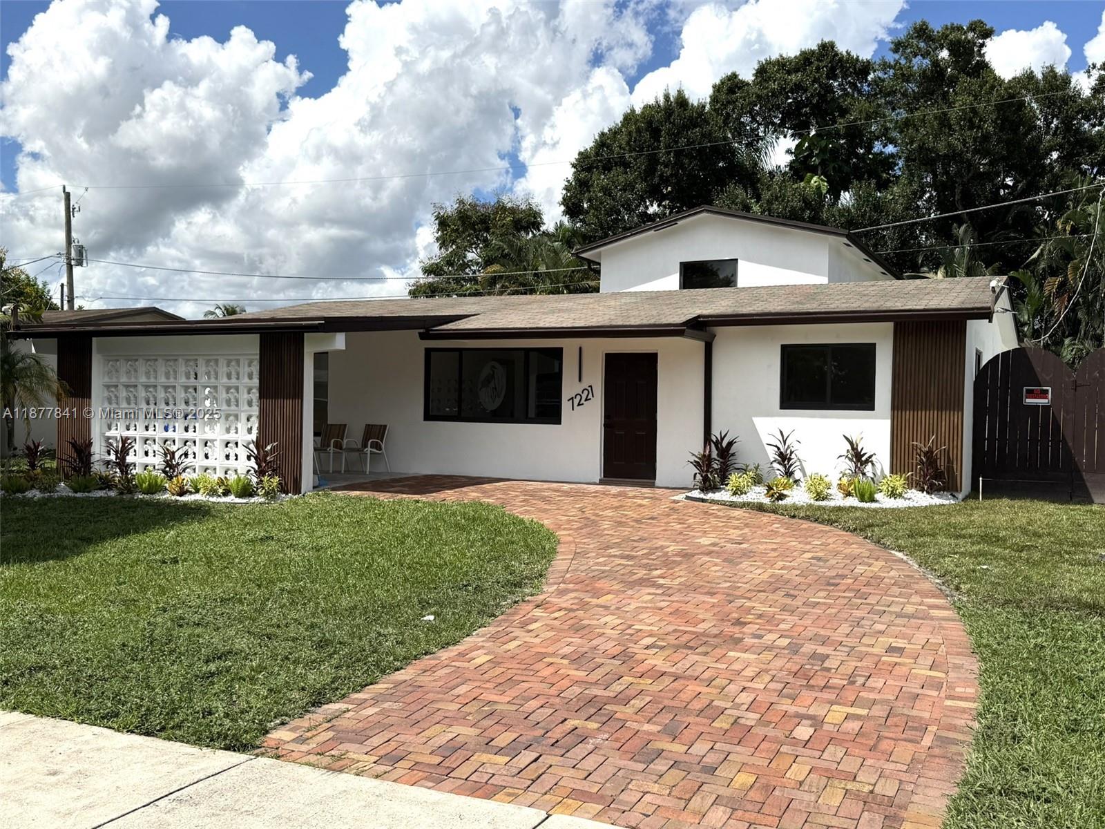 Hollywood Modern Gem with Generator & Huge Backyard!
Stunning, fully remodeled 4-bed, 2.5-bath home with 2,199 sq ft in highly desirable Hollywood! Move-in ready with modern upgrades: luxury vinyl floors, sleek cabinetry, quartz countertops, spa-style bathrooms with custom tile & vanities, plus energy-efficient LED lighting. Bright, open living & dining areas with a real fireplace create the perfect space for entertaining. Impact doors/windows + propane generator offer peace of mind. Enjoy a spacious backyard with a screened enclosure over pavers for outdoor living year-round. Ample parking with carport & extended paver driveway. Prime location—just 8 min to Hard Rock Hotel & 20 min to the beach!