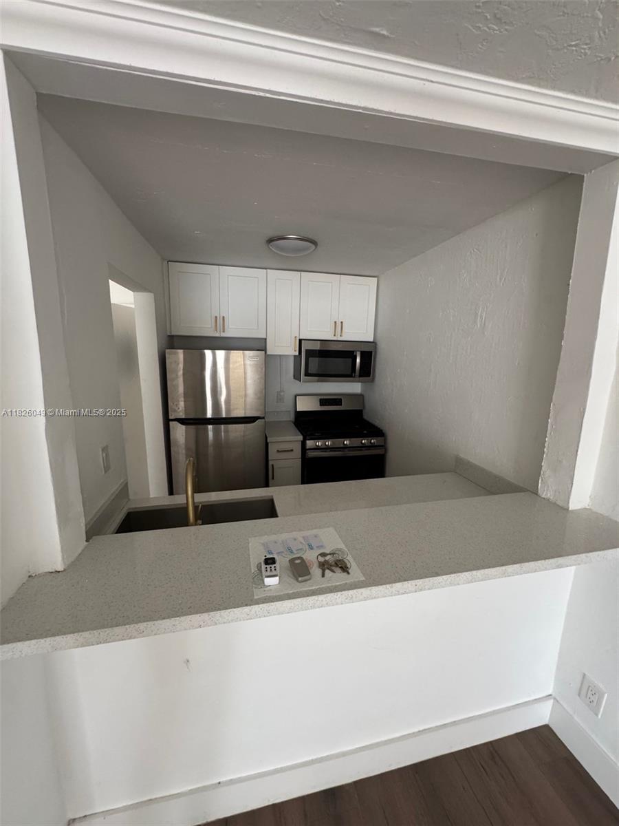 Located in Miami's Edgewater neighborhood. This 2-bedroom, 1-bathroom condo offers a comfortable living space filled with abundant natural light and refreshing ocean breezes, an open layout, vinyl flooring, and an updated kitchen and bathroom. Step out onto your private balcony to take in beautiful bay views. The building offers amenities such as a pool, shared laundry facilities, and one assigned parking space. Conveniently located just minutes from Midtown, Wynwood, and Downtown Miami, and within steps of Paraiso Park, this prime location offers easy access to expressways and the vibrant Miami Design District. Quick move-in is available.