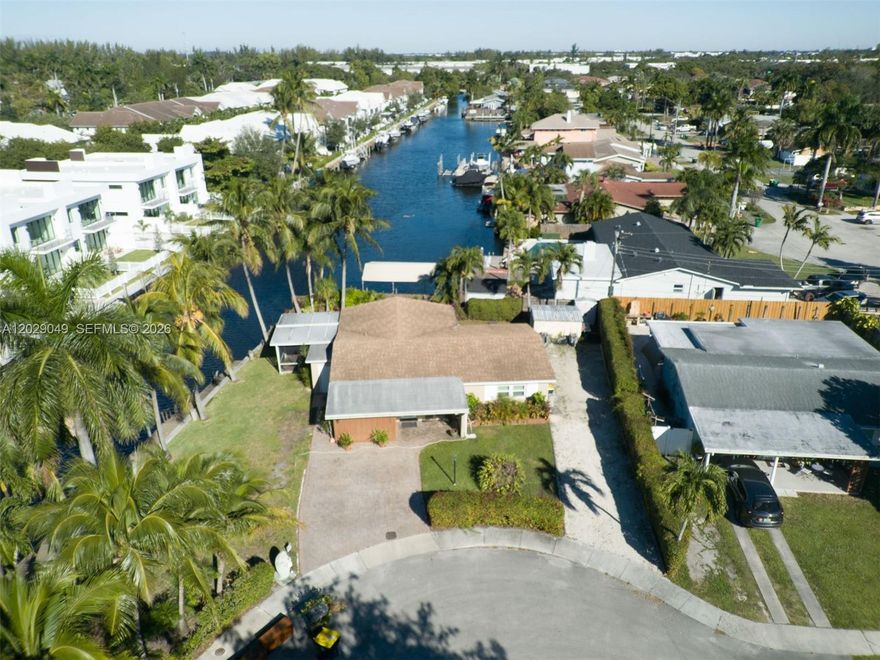 Experience the ultimate South Florida waterfront lifestyle in this meticulously maintained single-family home
located on a quiet residential street. This boater’s dream property features a rare 120-foot seawall and a private
wood dock with deep-water canal access to the Atlantic Ocean, plus a nearby public boat ramp for added
convenience. Designed for comfortable living and entertaining, the home offers a spacious 3-bedroom, 2-bath split
floor plan with an open-concept kitchen, formal living room, and a bright family room that flows seamlessly
through dual sliding doors to the outdoor living area. Enjoy year-round coastal living from the screened waterfront
porch or the open patio perfect for relaxing, hosting guests, and taking in the water views. The residence is move in ready and upgraded with hurricane-impact windows and doors, providing enhanced safety and peace of mind.
With no HOA and generous parking space for a boat, RV, or trailer, this property offers exceptional flexibility and
freedom. Ideally located near major entertainment, dining, shopping, and the airport, this waterfront gem
combines prime location, lifestyle, and functionality a rare opportunity for buyers seeking the best of South Florida living.