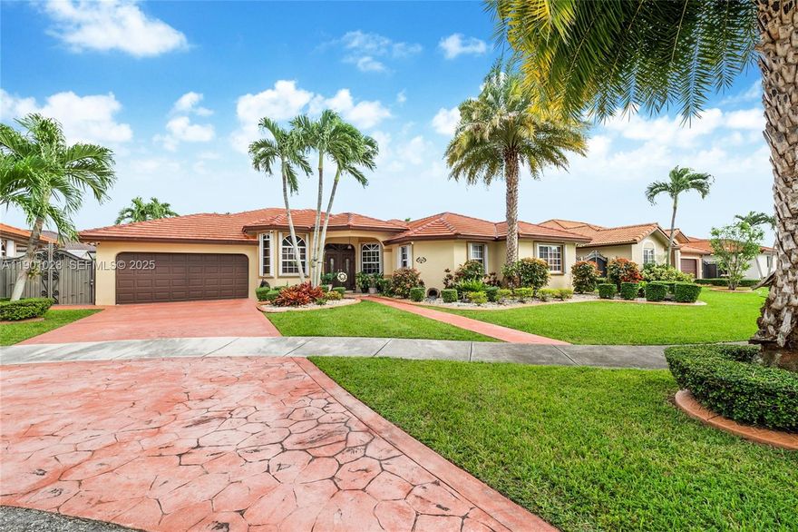 Arrive to tropical palm trees & live worry free in this spacious and gorgeous 1998 home with a newer 2016 quality tile roof & a salt water pool! Enter through double doors to a bright open living area with vaulted ceilings. The south wing of the home features all 4 bedrooms, with 2 side by side in front, the third off the hallway & the primary bedroom in the rear with ample en-suite bathroom. Lovely kitchen with breakfast nook overlooks the patio/pool. A separate home office is located on the north end near 2 car garage and family room. Dine at Islas Canarias or drive up Bird Road through Coral Gables and Coconut Grove for all that Miami has to offer! Near FIU and highways!