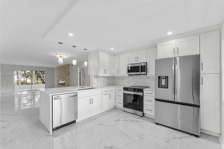 Beautifully renovated condo located in a 55+ community, featuring incredible details throughout.The living area showcases a stunning stone wall fireplace,along with a built-in mini wine cooler and brand-new appliances.
The unit offers two bedrooms and two full bathrooms, plus a new water heater. It also features elegant glass doors and a lovely porch overlooking the pool,with beautiful views and an additional closet for extra storage.
The Wynmoor Community condominium offers an exceptional lifestyle with a wide variety of amenities, including a gym, theater, business center, spa, 24/7 security, and beautifully maintained grounds. The community is known for being peaceful, safe, and very well managed.
Residents also enjoy a complimentary shuttle service.