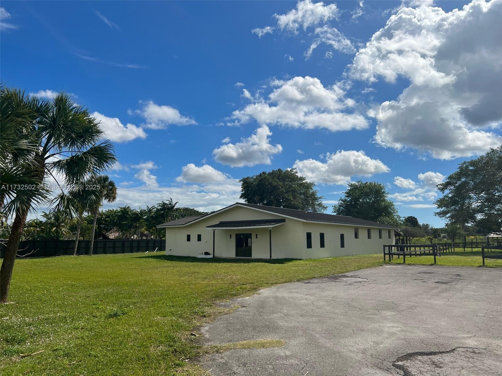 Located in the very desirable location of Horse Country, this beautiful modern home with attached stables sits on an acre of land. The home has 3 Bedrooms and 2.5 bathrooms, a separate 4th room used for storage or staff quarters. Currently setup for 4 stables and is customizable up to 8 stables at the request of renter's needs with the option to build exterior stables for tenants requiring more than 8 stables. The property features a large horse corral perfect for riding and training along with many other beautiful embellishments.