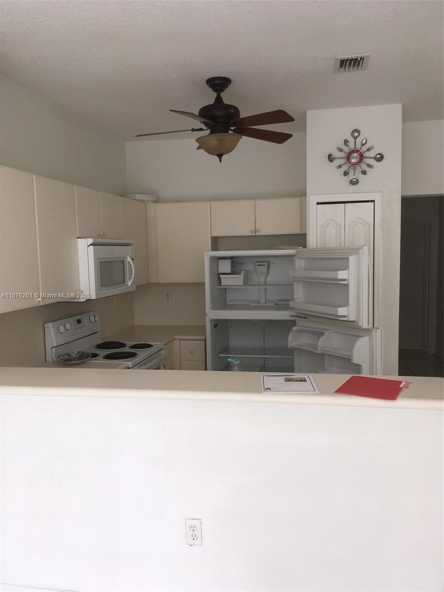 This second-floor property features two bedrooms and two baths. The interior of the property includes a washer and dryer. The property also has a backyard that leads to a park. With almost 1,000 square feet of living area, the bedrooms are in a split plan. This configuration allows for a living room and dining room area while maintaining a great flow to the property.