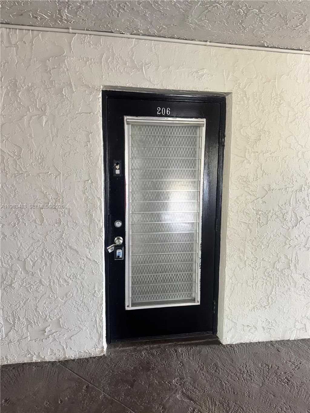 Photo of 9400 Lime Bay Blvd #206, Tamarac, FL 33321 (MLS # A11983483)