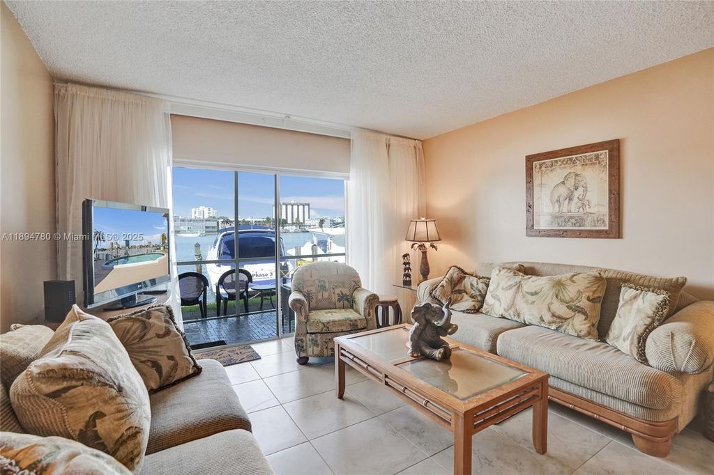 Photo of 300 Golden Isles Dr #101, Hallandale Beach, FL 33009 (MLS # A11894780)