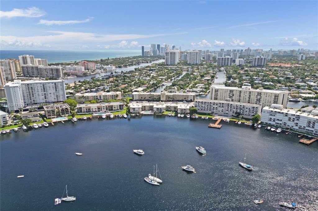 Photo of 300 Golden Isles Dr #101, Hallandale Beach, FL 33009 (MLS # A11894780)