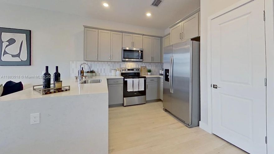 Stunning brand new 4 bedroom, 3 bath corner townhouse in the sought-after Merrick Square community! This home features a first floor bedroom and full bath, perfect for guests or multigenerational living. The open-concept kitchen includes granite countertops, a waterfall island, subway tile backsplash, and Whirlpool stainless steel appliances. Enjoy a private patio, impact windows, frameless glass showers, and smart home technology. Being a corner unit, the home offers extra privacy and natural light. The gated community provides clubhouse, pool, fitness center, and more. Photos showcase builder's model home finishes and furnitures - schedule your showing today!